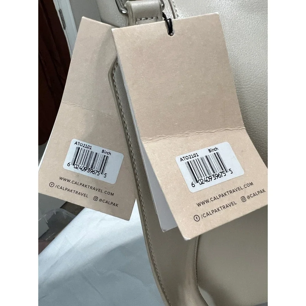 CalPak Taupe Leather Tote Bag with Adjustable Strap. Tags are no longer intact.